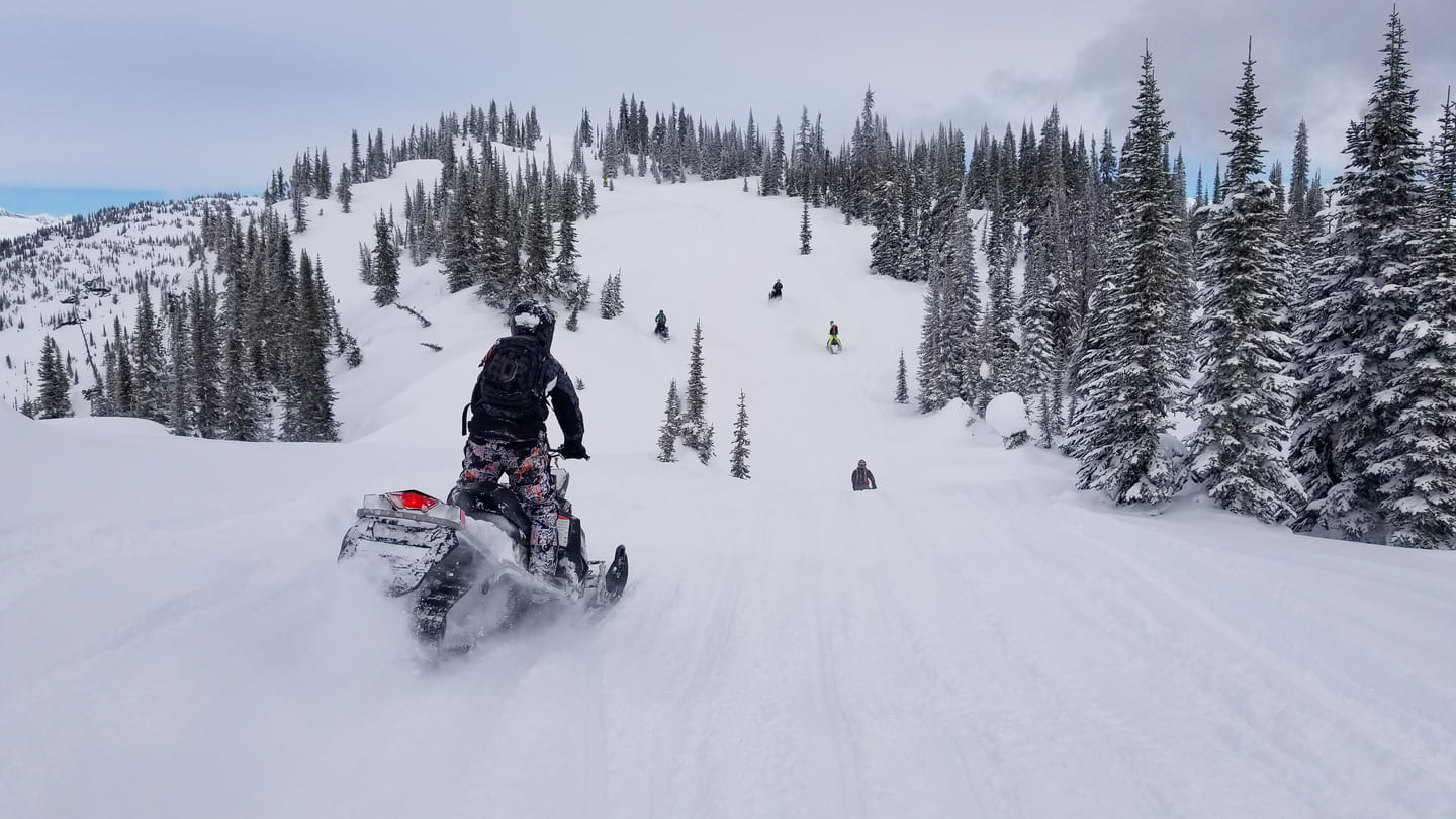 motorbiking on snow in a ski resort in revelstoke canada